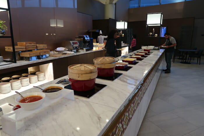 a buffet line with food on the counter