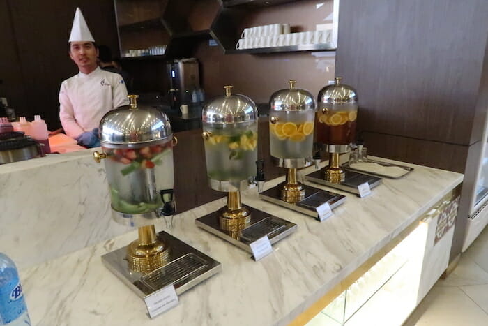 a group of water dispensers on a counter