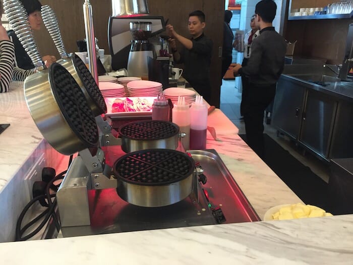 a group of people in a kitchen