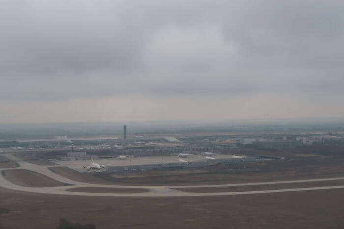 an airport with planes in the background