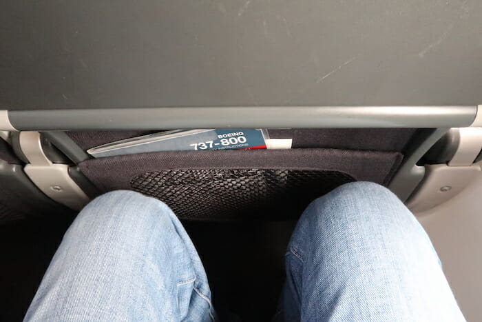 a person's legs in a seat