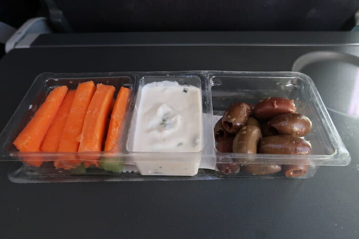 a tray of food with different types of vegetables