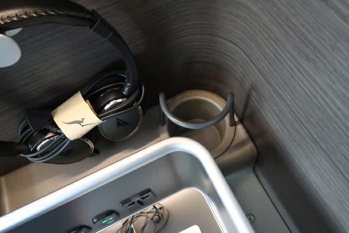 a headphones and a cup in a cup holder