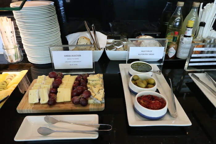 a table with plates of food and plates of food