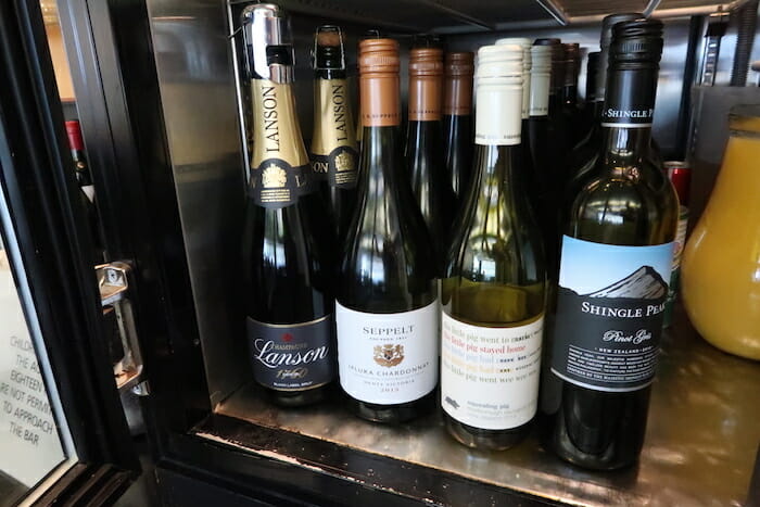 a group of wine bottles on a shelf