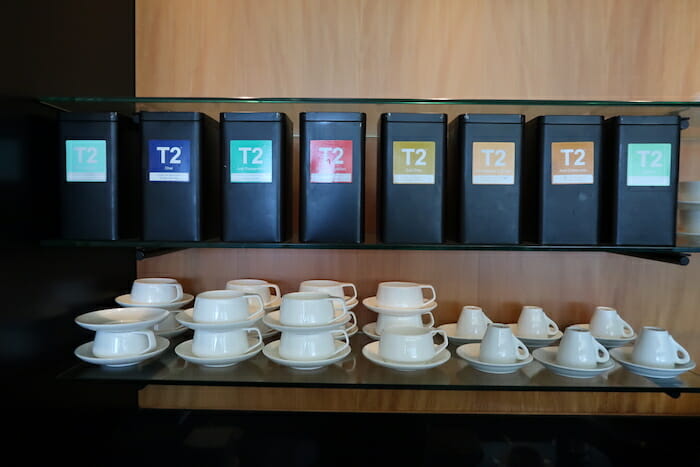 a shelf with cups and saucers