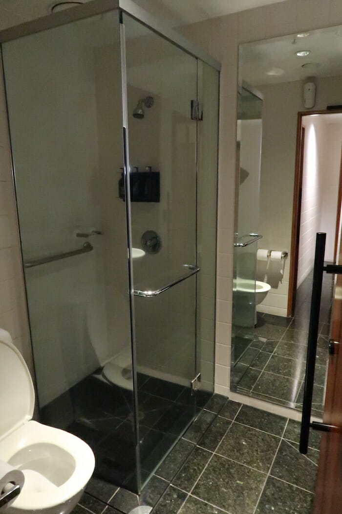 a glass shower in a bathroom