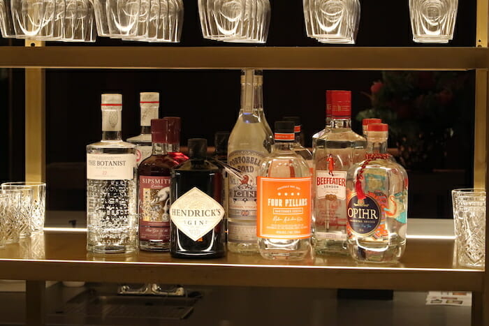 a shelf with bottles of alcohol