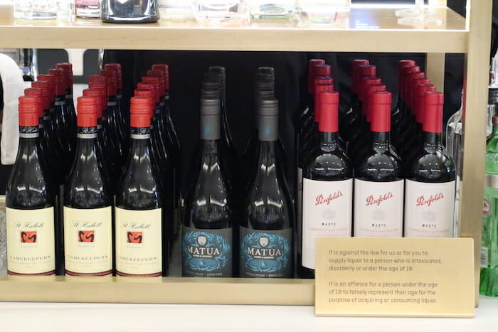 a shelf with bottles of wine