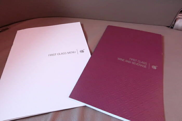 a couple of menus on a leather surface