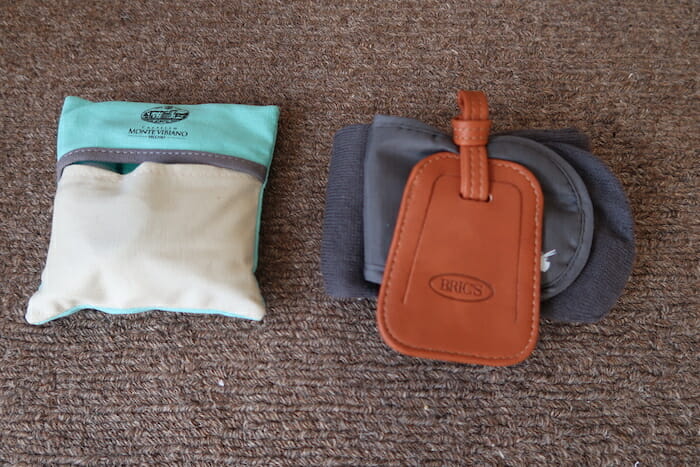 a pair of pouches and a tag