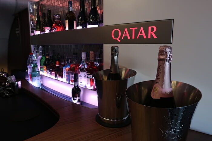 bottles of alcohol in buckets on a shelf