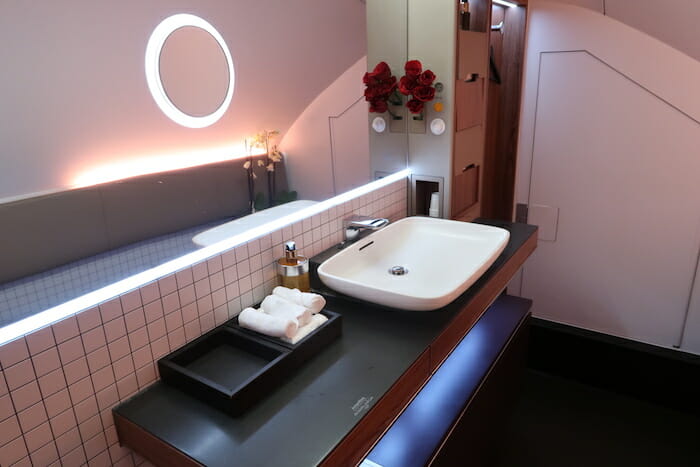 a bathroom with a mirror and sink