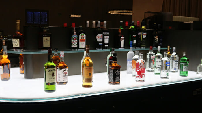 a group of bottles of alcohol on a shelf