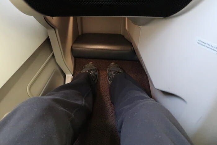 a person's legs in a seat