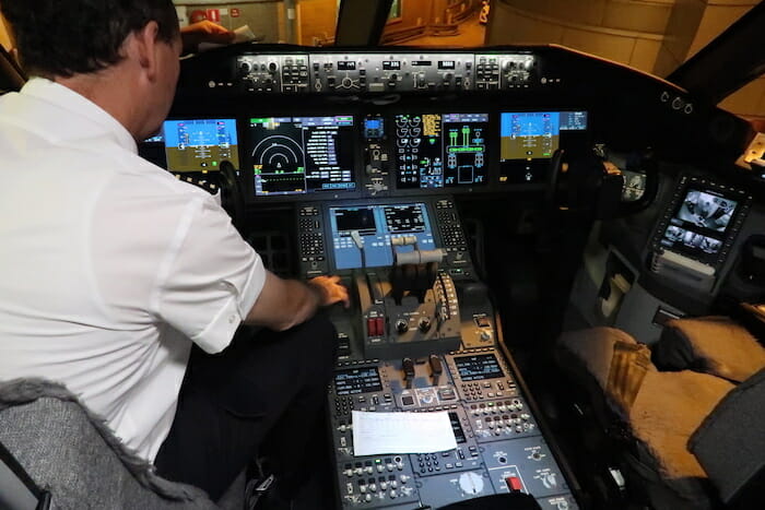 a man sitting in a cockpit