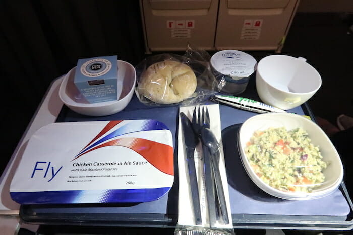 a table with food and a bowl of food on it