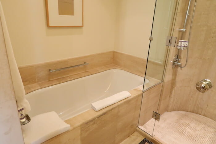 a bathroom with a bathtub and shower