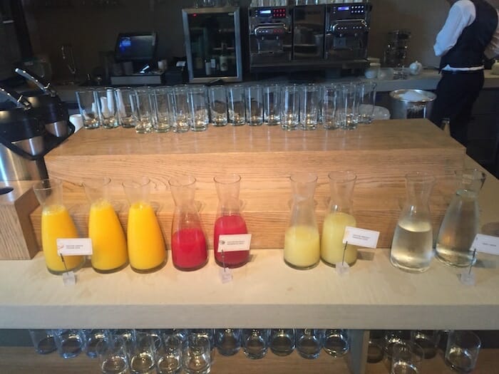 a table with glasses and bottles of liquid