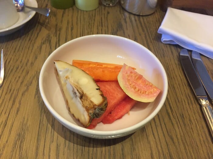 a bowl of fruit on a table