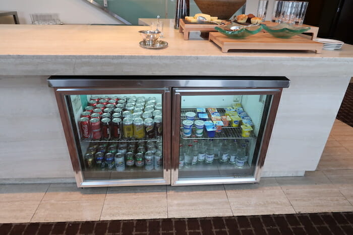 a refrigerator with drinks and beverages in it