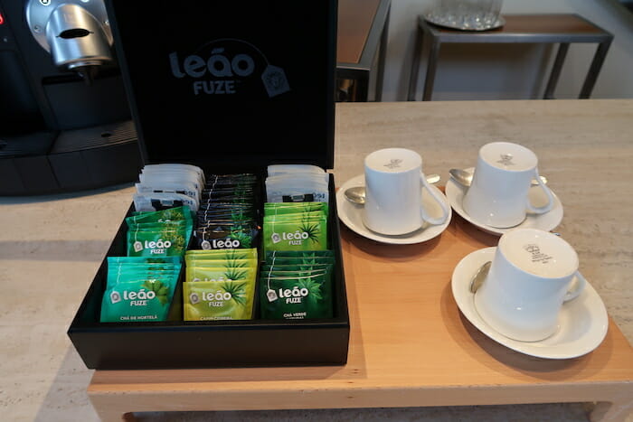 a box of tea bags and cups on a table