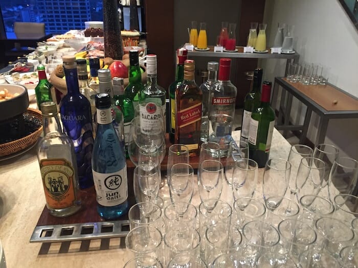 a table with many empty glasses and bottles