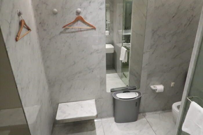 a bathroom with a mirror and a toilet