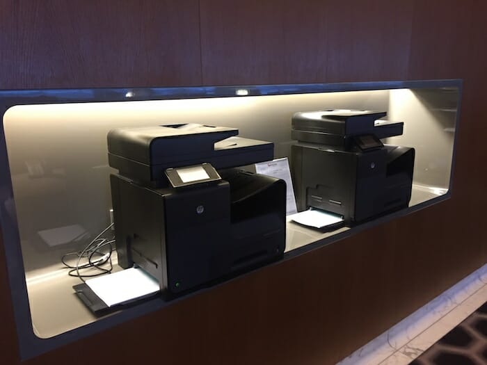 a group of black printer on a shelf