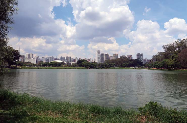 a lake with a city in the background