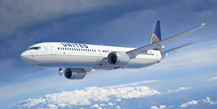 a white airplane flying in the sky