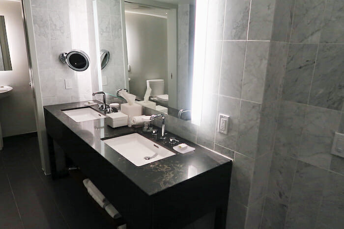 a bathroom with a mirror and sinks