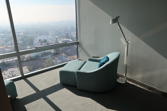 a chair in a room with a large window