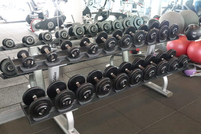 a rack of weights in a gym