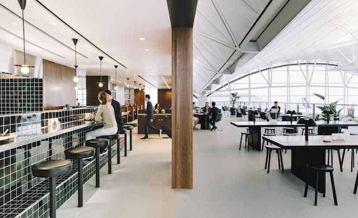 people sitting at tables in a restaurant