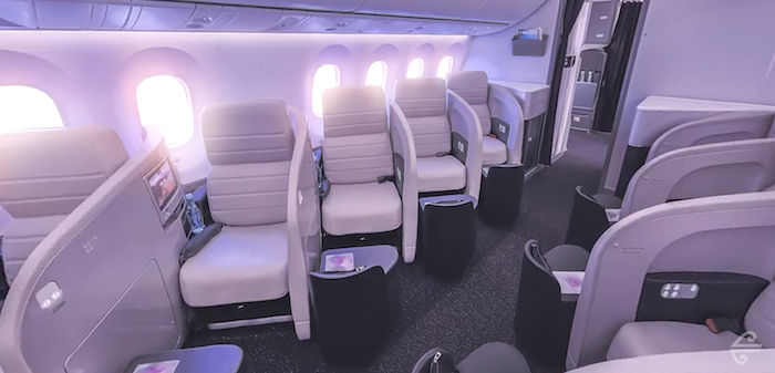 a row of white seats in an airplane