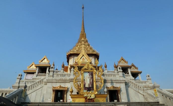 a building with a gold and white structure