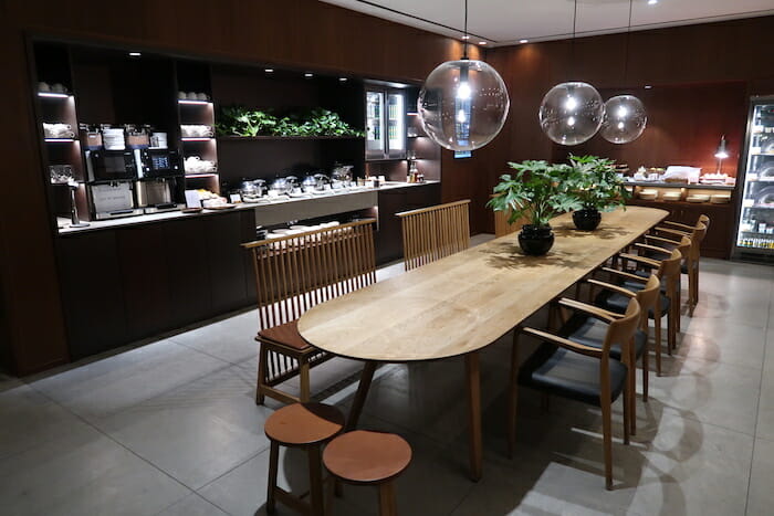 a dining room with a long table and chairs