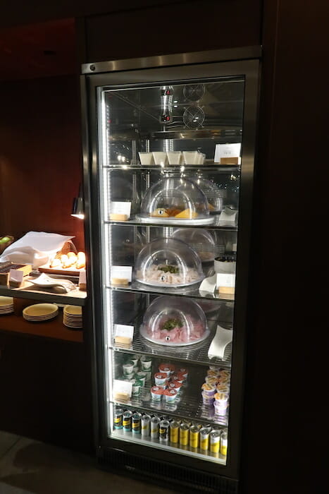 a glass case with food on it