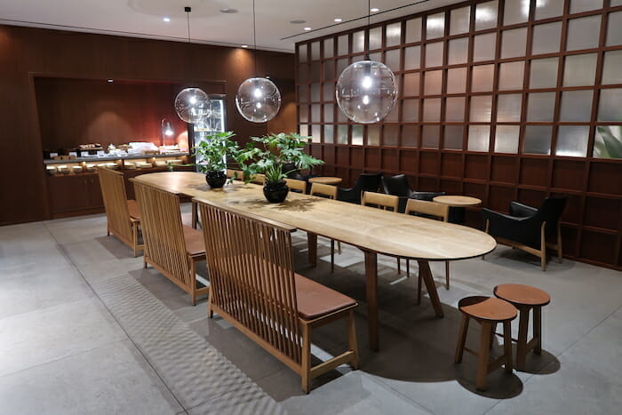 a room with a long table and chairs