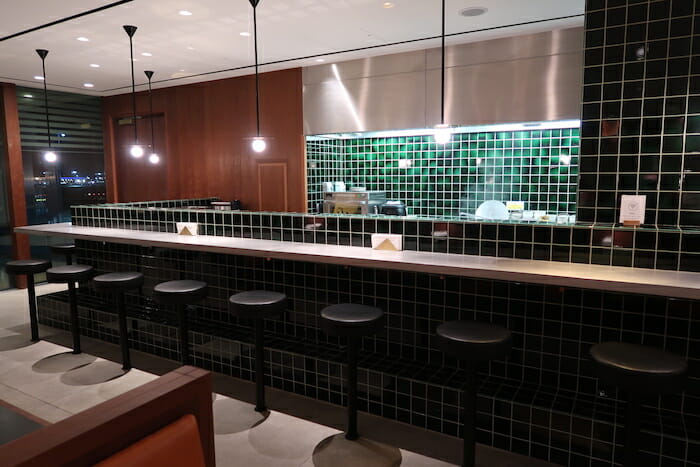 a bar with stools in a restaurant