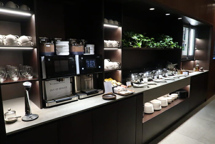 a coffee machine and plates on a counter