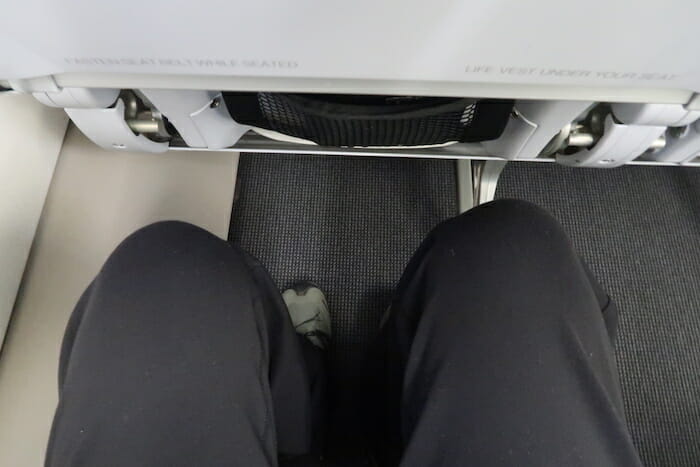 a person's legs on a seat