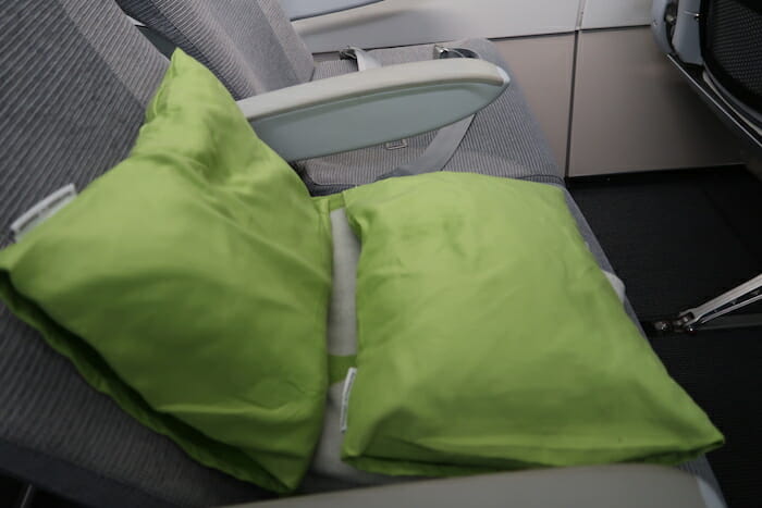 a green pillow on a chair