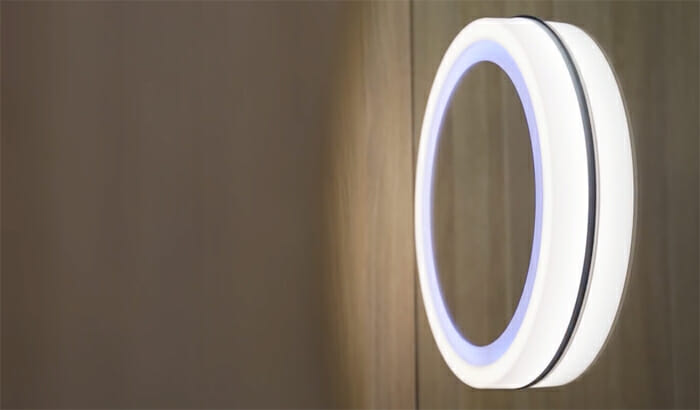 a circular light fixture on a wall