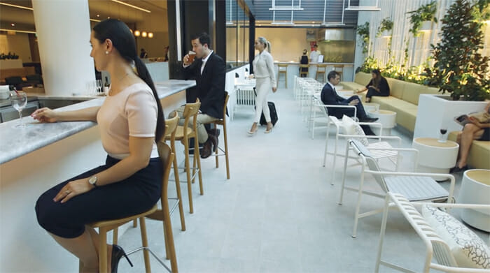 people sitting in chairs in a room