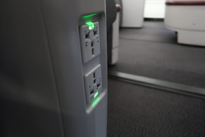 an electrical outlet with green light