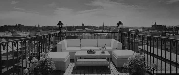 a patio with a table and chairs