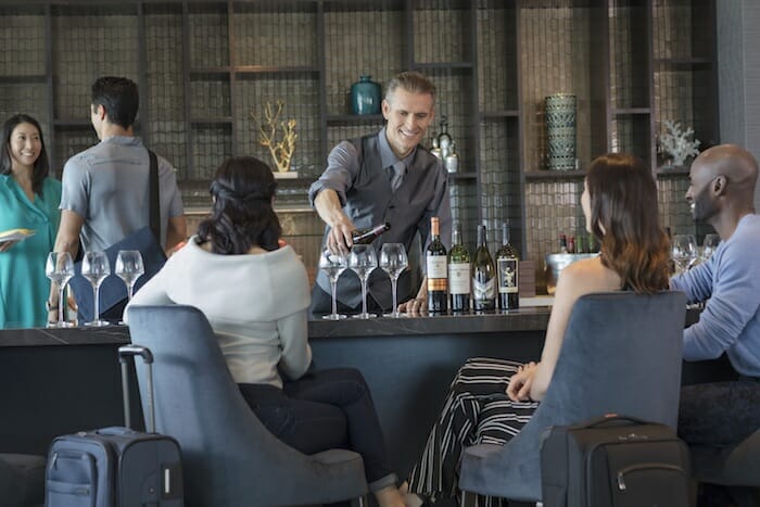 a man pouring wine into a glass