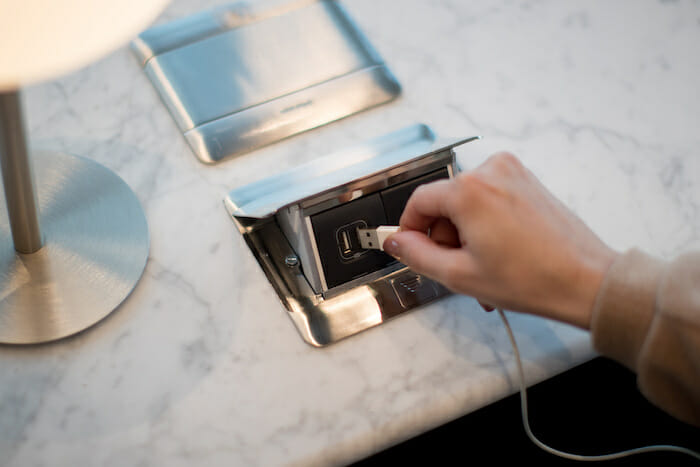 a hand holding a usb cable